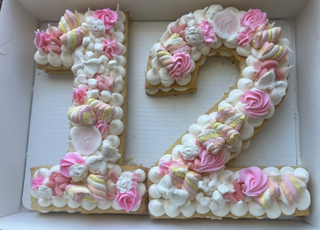 Number twelve cream tart with pink roses and marshmallows for Bat Mitzvah