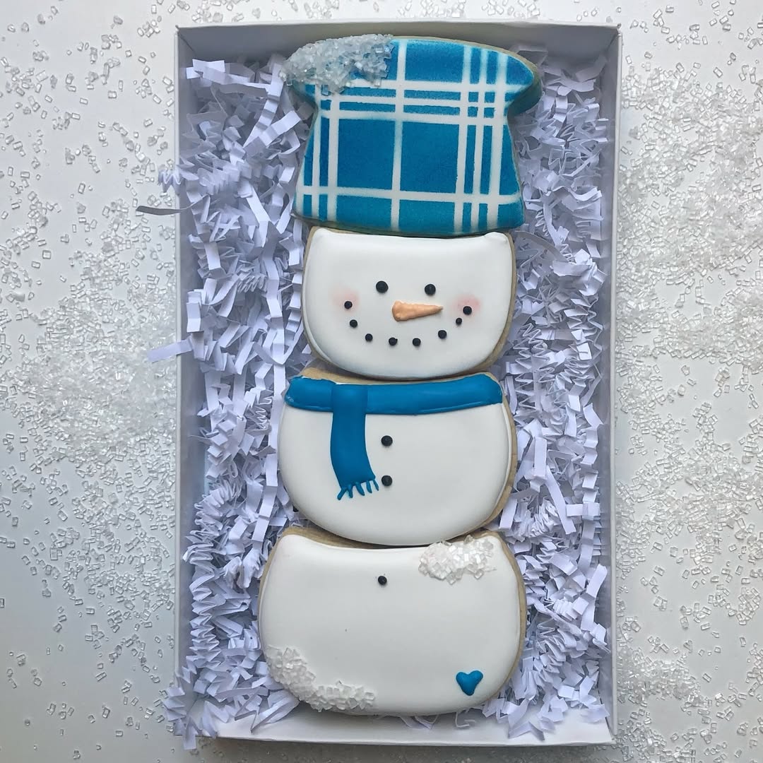 Stacked snowman cookies with plaid hat